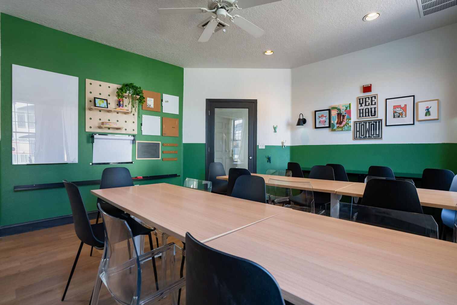 Kids club room with desks and chairs, craft supplies and games